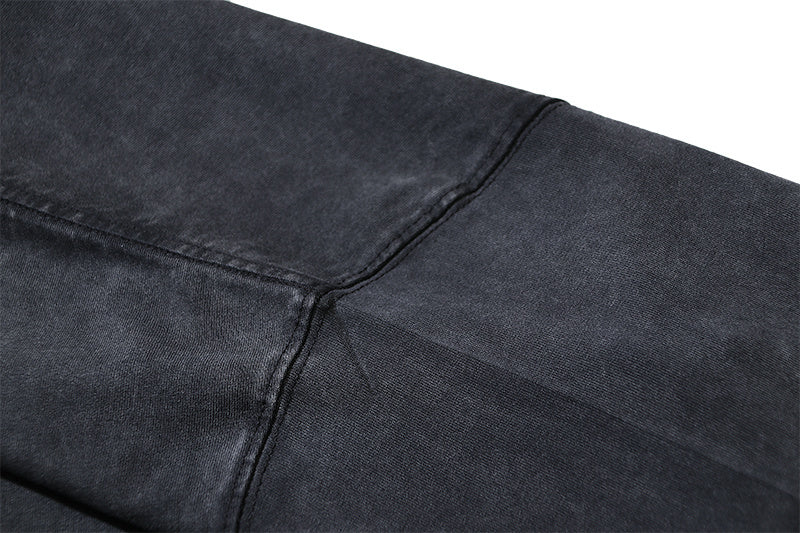 Dark gray T-shirt with stitched side seam and curved hem
