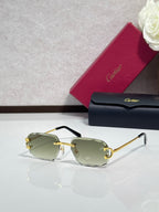 Cartier eyeglasses with green-tinted lenses, gold frame, black arms