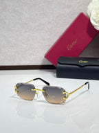 Cartier eyeglasses with dark gradient lenses, gold frame, black arms
