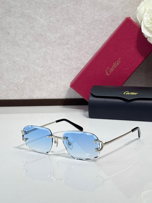 Cartier eyeglasses with light blue gradient lenses, gold accents, black arms