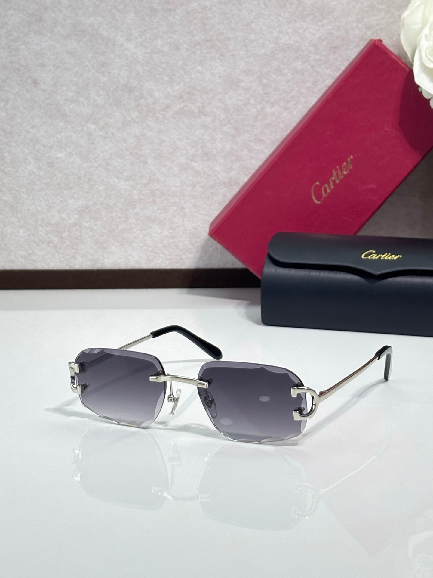 Cartier eyeglasses with gray gradient lenses, gold frame, black arms