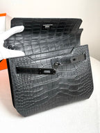 Hermes bag open showing dark croc-embossed interior and front flap hardware