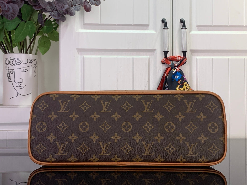 Louis Vuitton monogram duffel bag with top zipper and tan trim