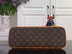Louis Vuitton monogram duffel bag with top zipper and tan trim