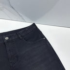 Versace dark blue denim jeans close-up of waistband with front curved pocket