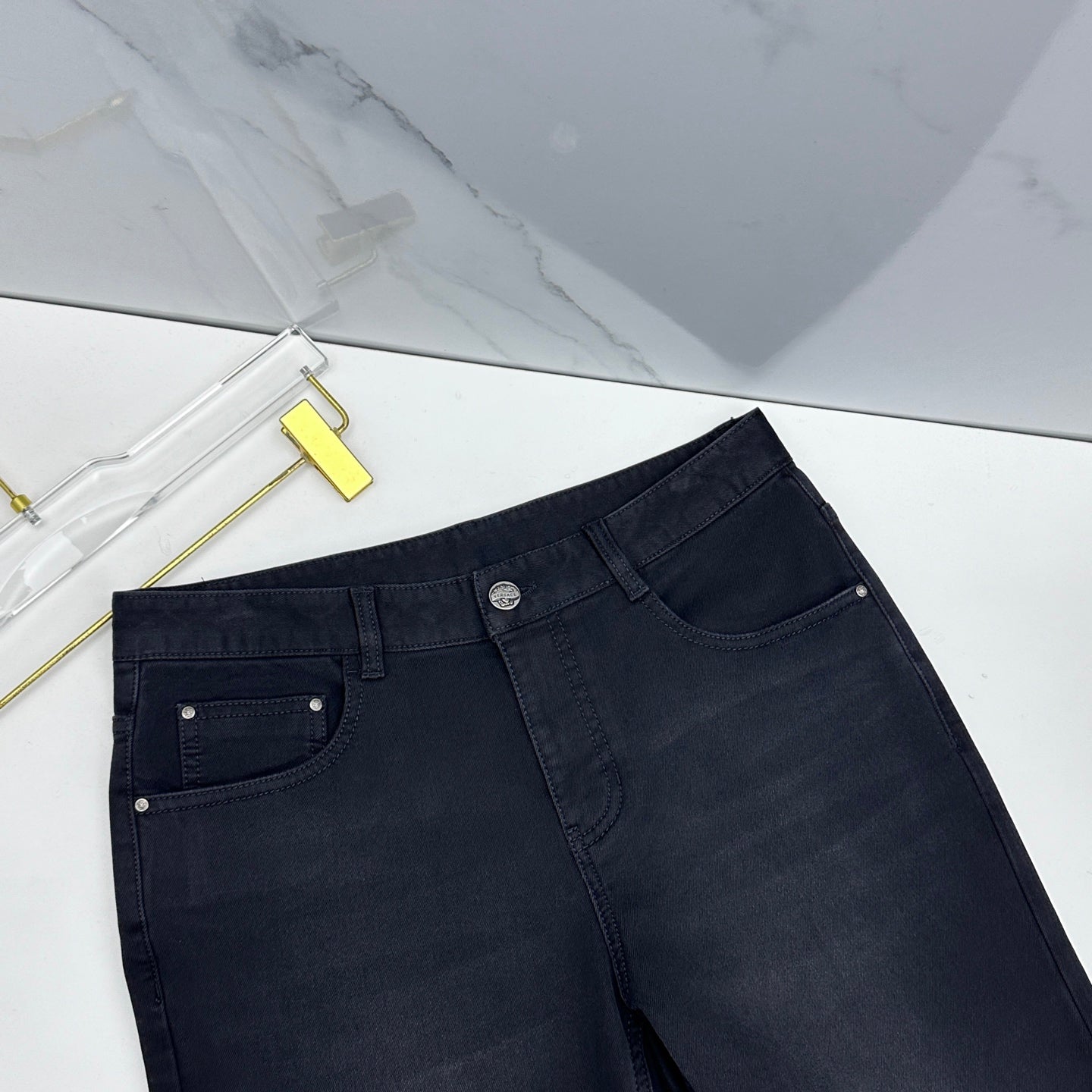 Versace dark blue denim jeans close-up of waistband and front pockets