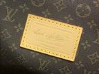 Monogram canvas label patch with gold trim and embossed text card