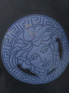 Navy T-shirt chest print: blue Medusa coin-style emblem