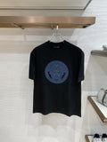Versace black T-shirt with blue Medusa circular graphic on chest