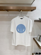 Versace T-shirt in white with blue circular horse graphic on the front.