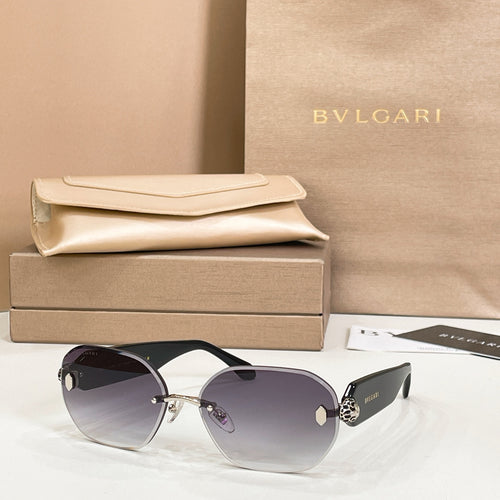 Bvlgari sunglasses with dark gradient lenses and gold-tone frame hardware