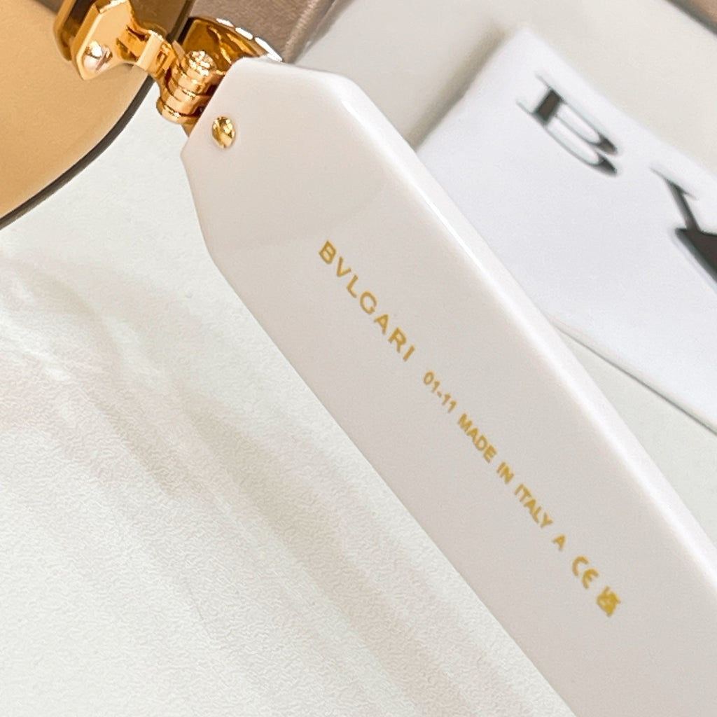 Round sunglasses temple with gold-toned hinge and Bvlgari logo