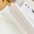 Round sunglasses temple with gold-toned hinge and Bvlgari logo