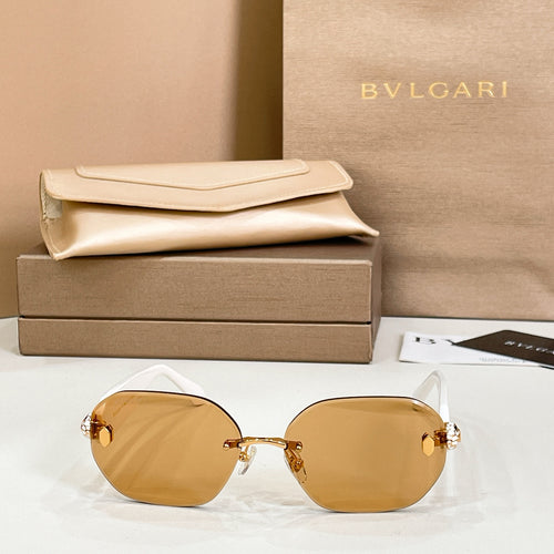 Round sunglasses with gold-tone frame and amber tinted lenses
