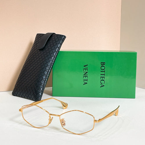 Sunglasses with dark lenses and gold-tone frames, shown with black textured case