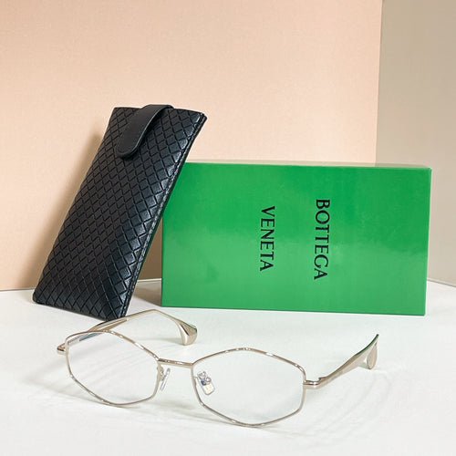 Sunglasses with dark lenses and gold-tone frames, front view with black textured case