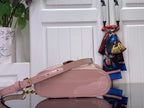 Louis Vuitton crossbody bag in mauve pink with adjustable strap and gold chain accents