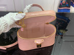Louis Vuitton mini handbag in pale mauve pink with gold zipper trim and inner view