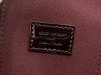 Louis Vuitton Paris logo patch on maroon leather interior pocket