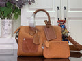 Tan leather Louis Vuitton handbag with front pocket flaps, top handle and strap.