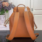 Cognac brown leather backpack with wide adjustable shoulder straps and top handle.