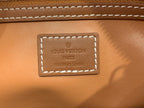 Tan Louis Vuitton leather logo patch with embossed 'LOUIS VUITTON' PARIS text.