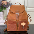 Louis Vuitton tan leather backpack with top handle, flap front, and multiple zip pockets
