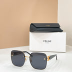 Celine sunglasses with dark tinted lenses and dark frame, gold logo accents
