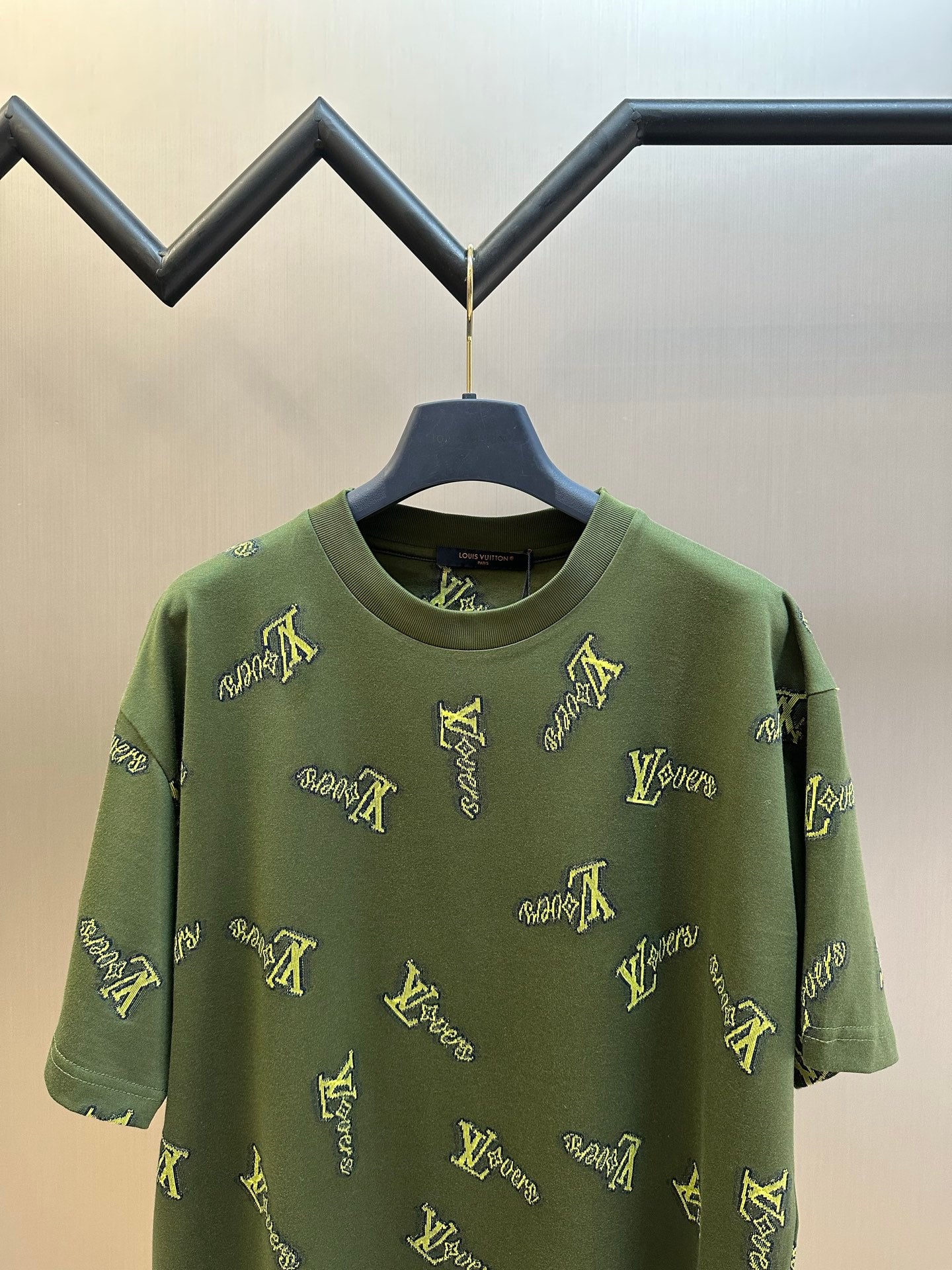 Green short-sleeve crewneck shirt with allover yellow LV-style logo embroidery