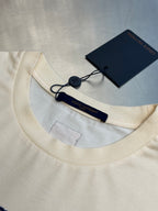 Louis Vuitton cream T-shirt neckline with seam stitching and hanging tag
