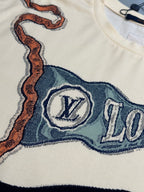 Louis Vuitton graphic patch on cream T-shirt with emblem and blue text