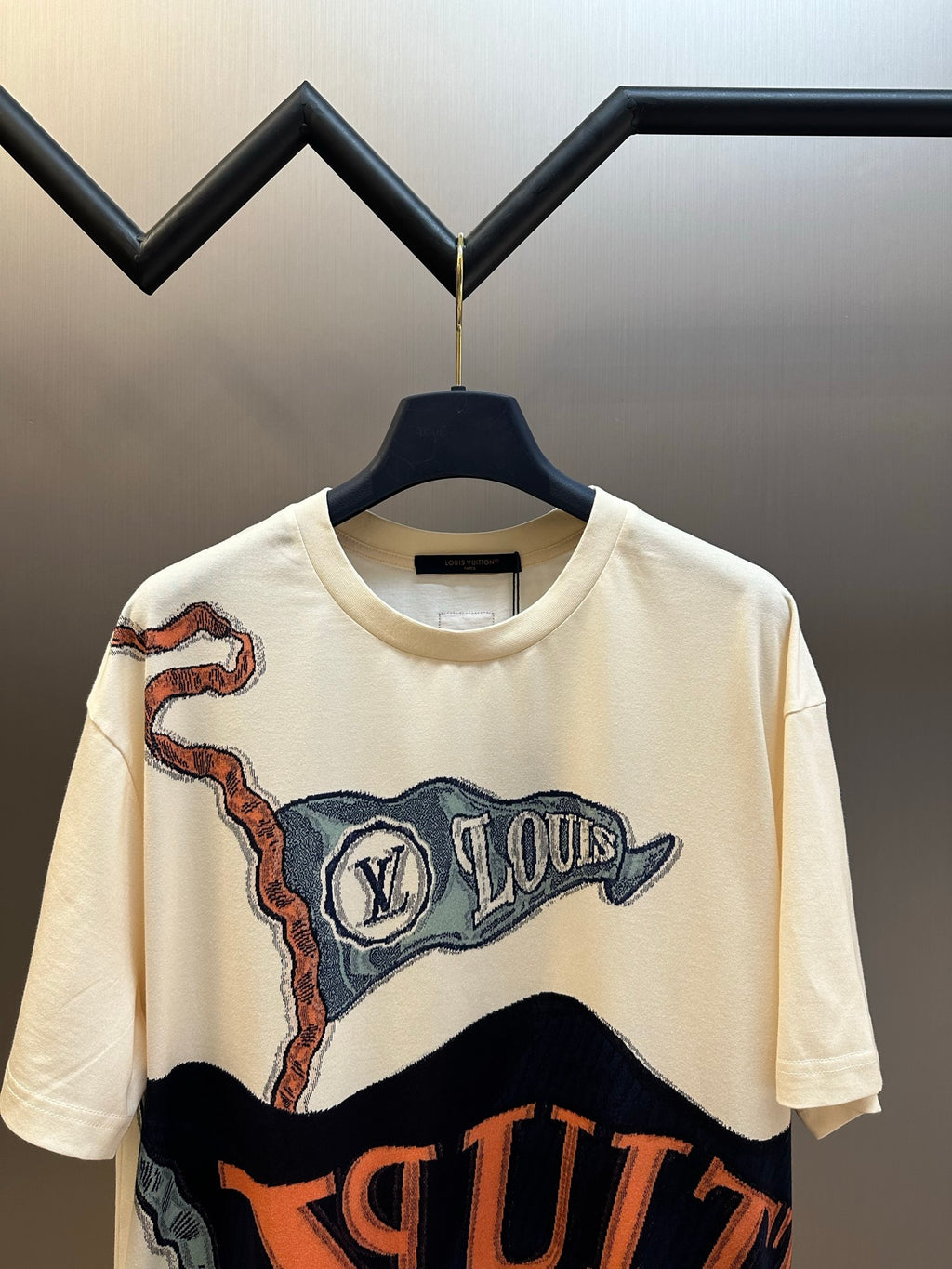 Louis Vuitton graphic T-shirt, cream with large blue-and-orange print, short sleeves