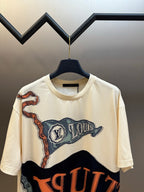 Louis Vuitton graphic T-shirt, cream with large blue-and-orange print, short sleeves