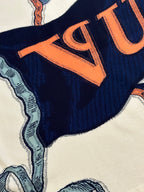 Louis Vuitton graphic T-shirt print with orange lettering on navy fabric