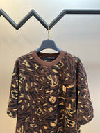 Louis Vuitton short-sleeve top with dark brown and gold abstract allover pattern, crew neck