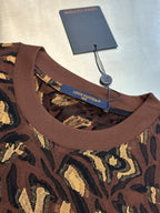 Louis Vuitton short-sleeve top neckline close-up with ribbed crew neck in dark brown