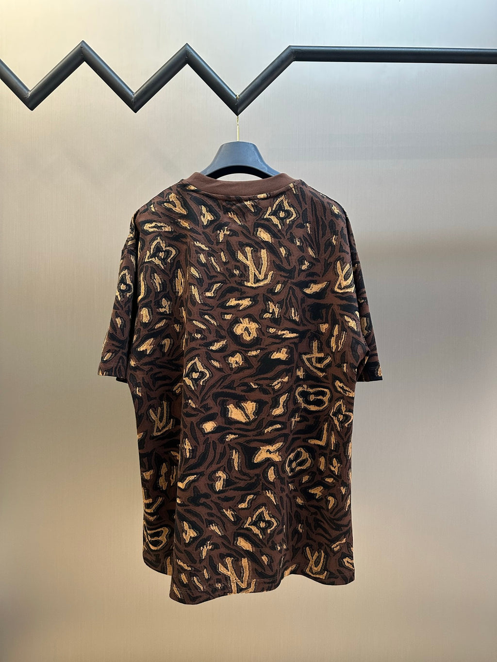 Louis Vuitton short-sleeve top back view in dark brown with gold allover pattern