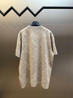 Beige monogram short-sleeve T-shirt back view on hanger