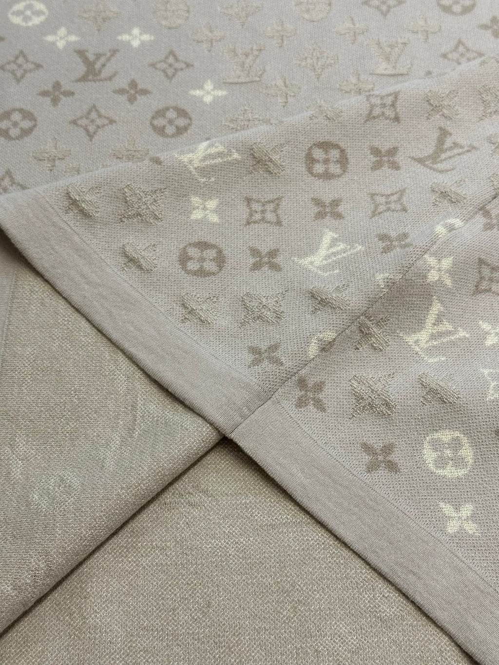 Monogram knit T-shirt fabric seam and drape in light beige