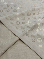 Monogram knit T-shirt fabric seam and drape in light beige