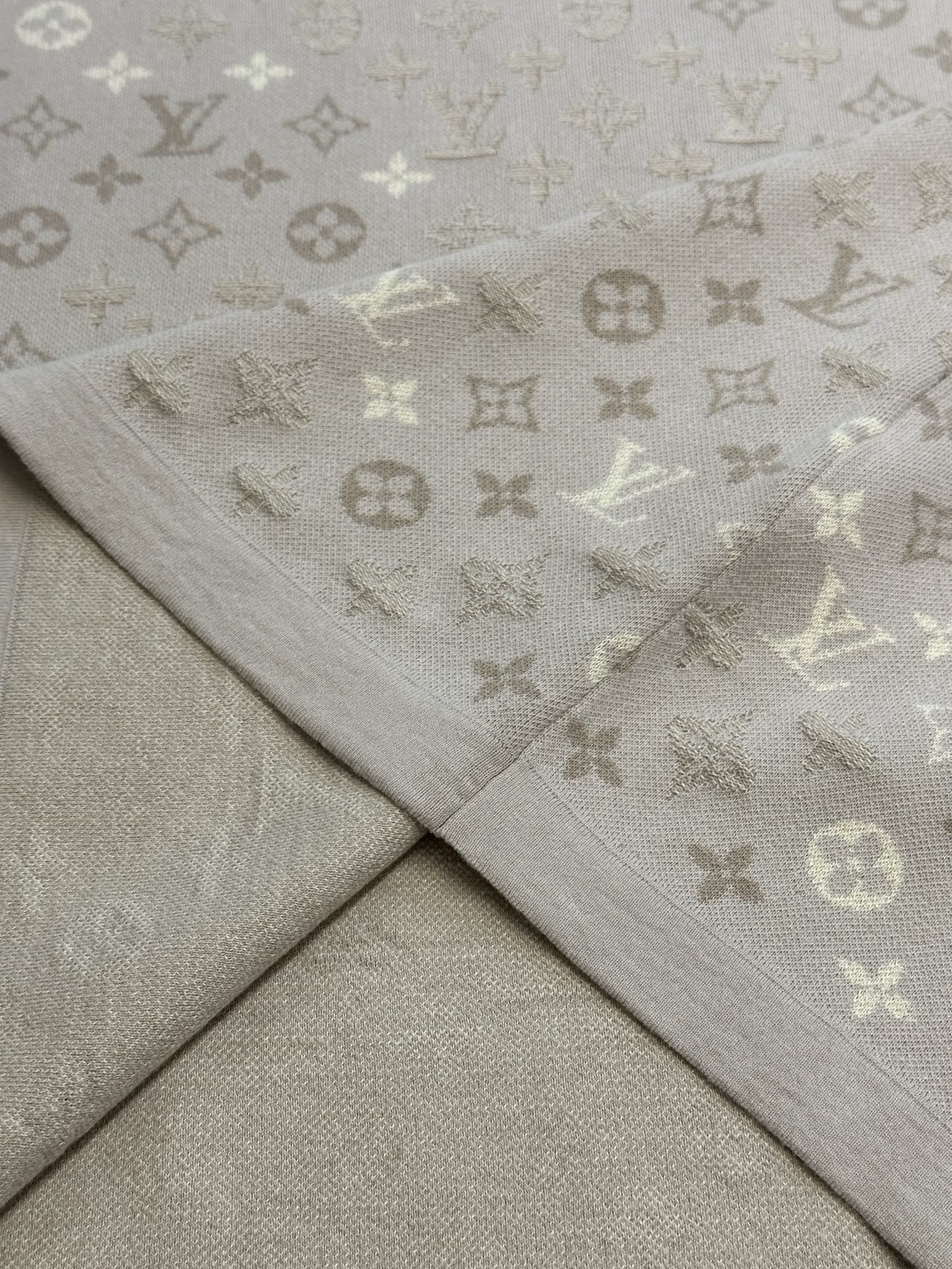 Monogram knit T-shirt fabric seam and drape in light beige