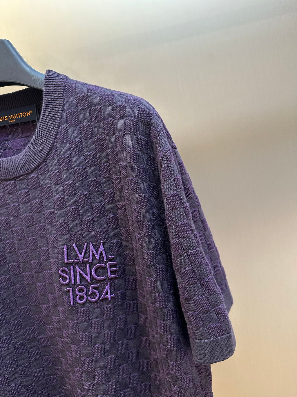 Louis Vuitton short-sleeve T-shirt detail with dark purple checker knit and chest logo
