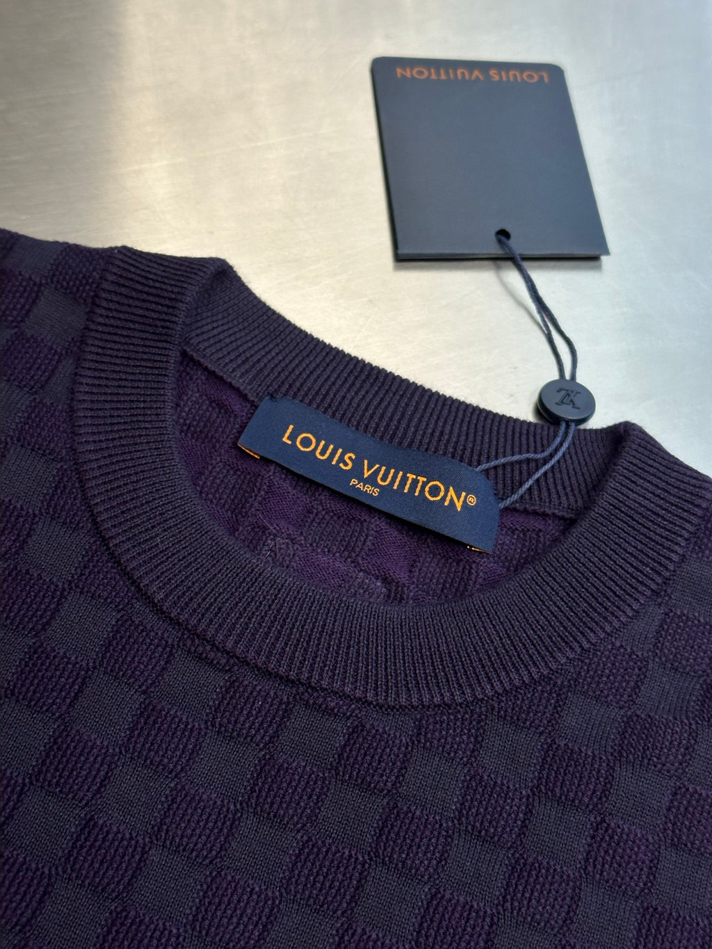 Louis Vuitton short-sleeve T-shirt neckline detail with ribbed collar and brand label