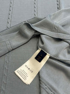 Light blue knit polo with interior neck label and stitched collar