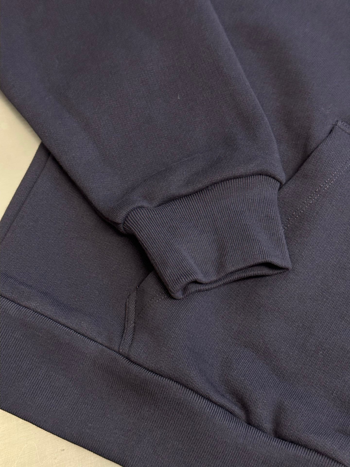Dark navy hoodie sleeve cuff and hem with ribbed trim
