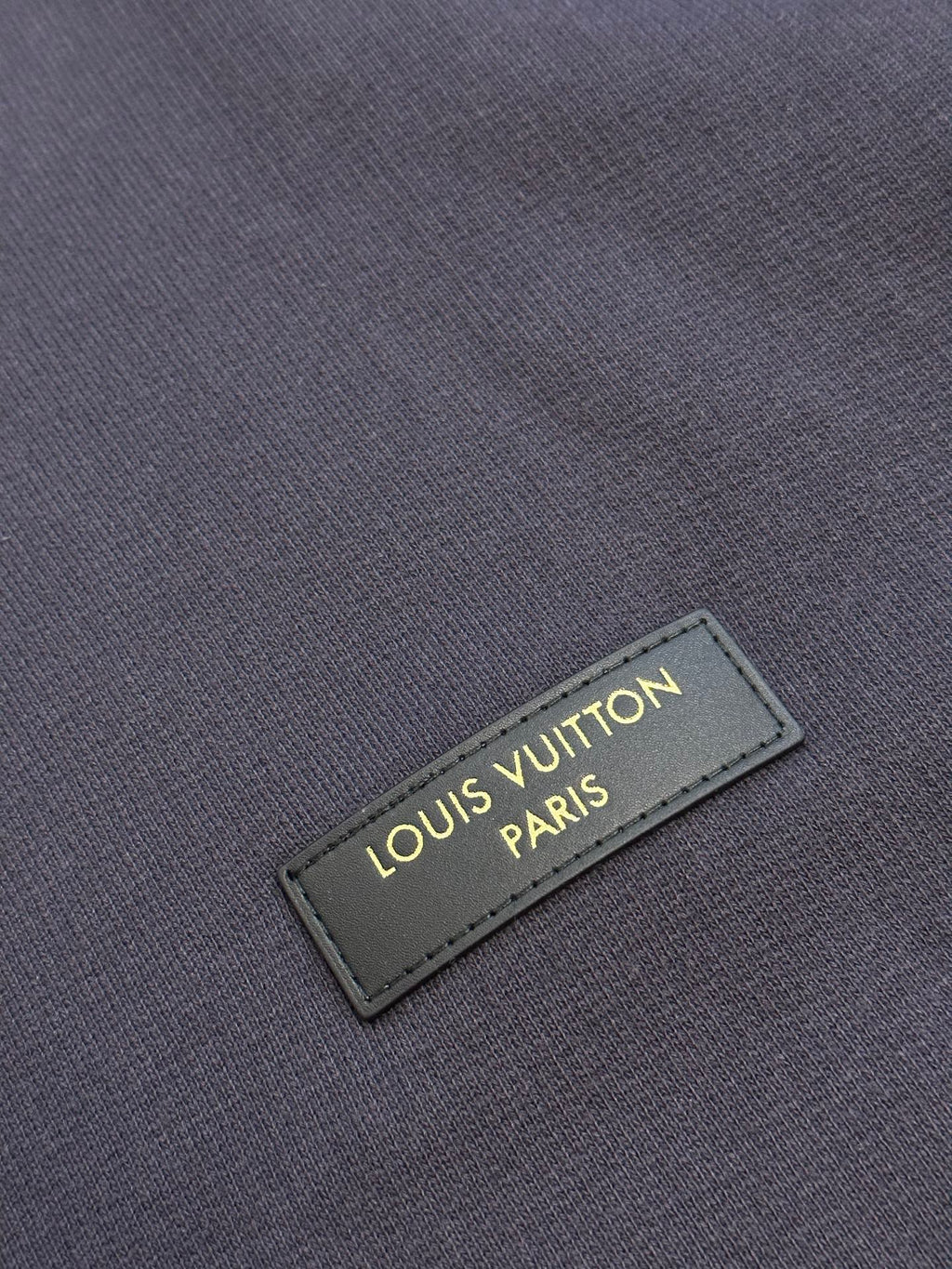 Dark navy hoodie with Louis Vuitton Paris leather logo patch
