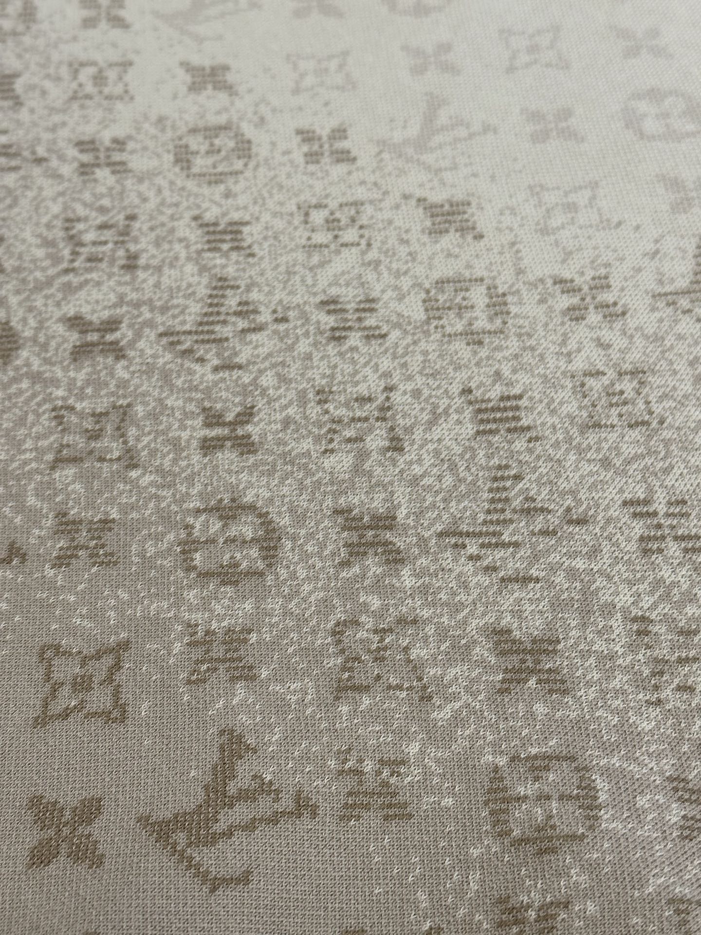 Light beige knit fabric with scattered Louis Vuitton monogram motifs