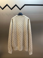Light beige crewneck sweater with all-over monogram, back view, long sleeves