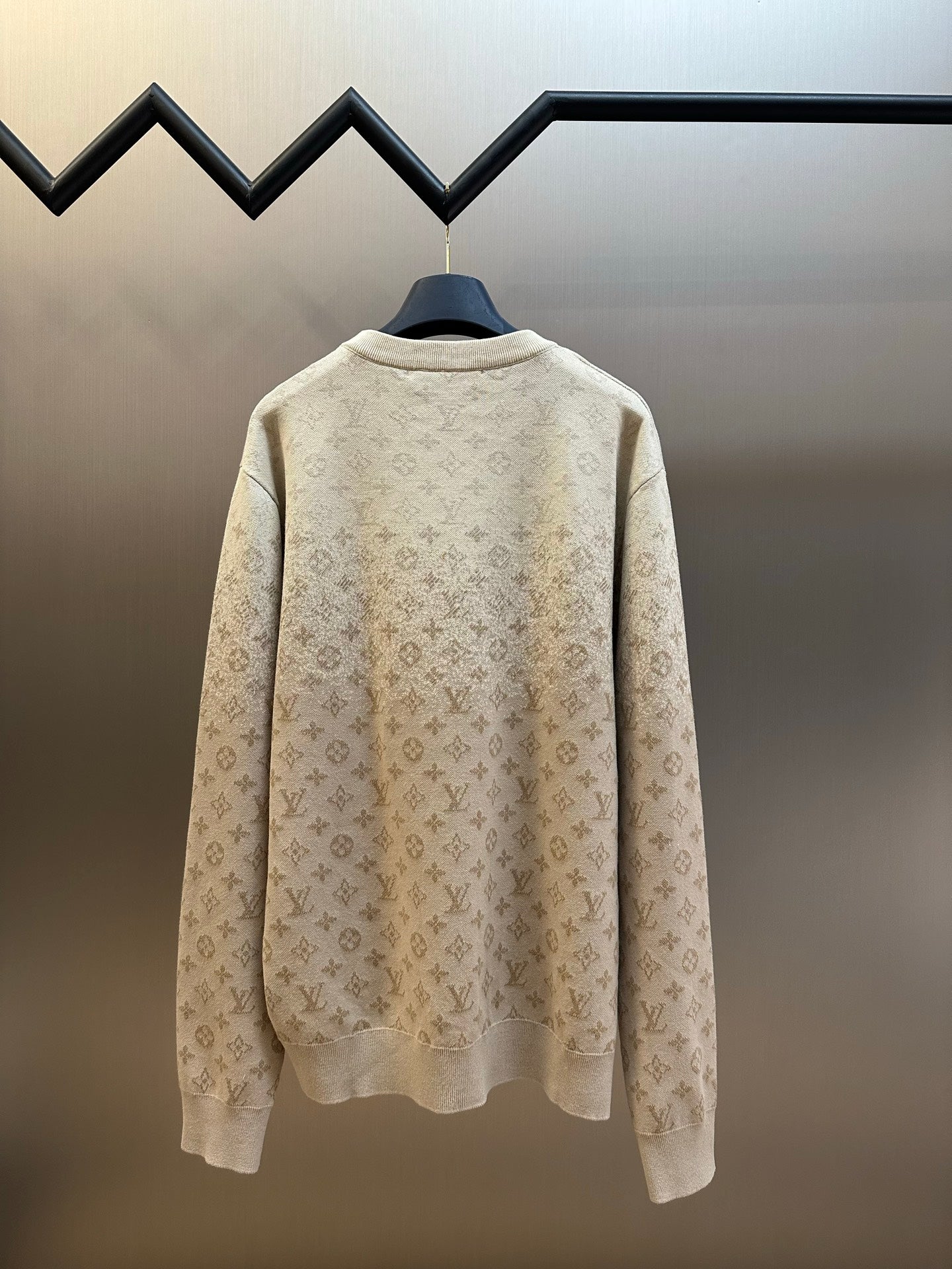 Light beige crewneck sweater with all-over monogram, back view, long sleeves