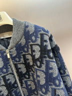 Logo knit zip jacket detail, blue and gray with long metal front zipper
